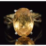 A 14k gold ring set with an oval cut citrine, 4.1g, size M/N