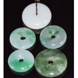 Five jadeite bi-disc, largest 2.9cm