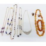 Five pearl necklaces set with rubies, sapphires, garnets and lapis lazuli, and an amber necklace and