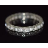 A 9ct white gold eternity ring set with paste, 2.1g, size L/M