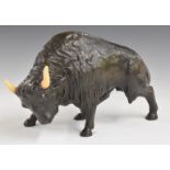Bronze study of a bison with ceramic horns, L28cm