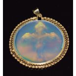 A yellow metal pendant set with a 3D cross, 4.5cm diameter