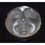 A loose moonstone carved as the man in the moon, 0.92cm