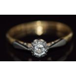 An 18ct gold ring set with a diamond in a platinum setting, 2g, size L/M