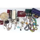 A collection of costume jewellery including Armani Exchange necklace, other necklaces, etc