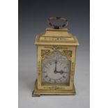 An early 20thC miniature faux lacquer cased clock, the silver dial inscribed Chas Frodsham, London