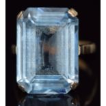 A 9ct gold ring set with an emerald cut aquamarine, 6.1g, size K