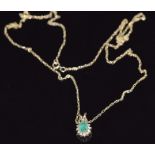 A 9ct gold necklace and a 9ct gold pendant set with an emerald and diamonds, 1.5g