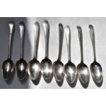 Eight Georgian Irish hallmarked silver dessert spoons with bright cut decoration, four Dublin