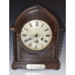 Gustav Becker c1920 oak cased mitre top mantel clock with barley twist decoration, the Roman dial