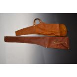 Two brown leather carbine rifle slips.