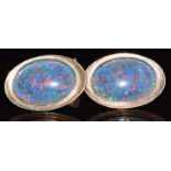 A pair of 9ct gold cufflinks set with black opal doublets, 12g