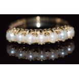 A 9ct gold half eternity ring set with split pearls, 1.7g, size N