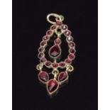 A 14k gold pendant set with Bohemian cut garnets, 1.7g, length 3.5cm