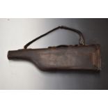 Brown leather leg of mutton shotgun case with fitted interior, wool lining and brass lock, 80cm
