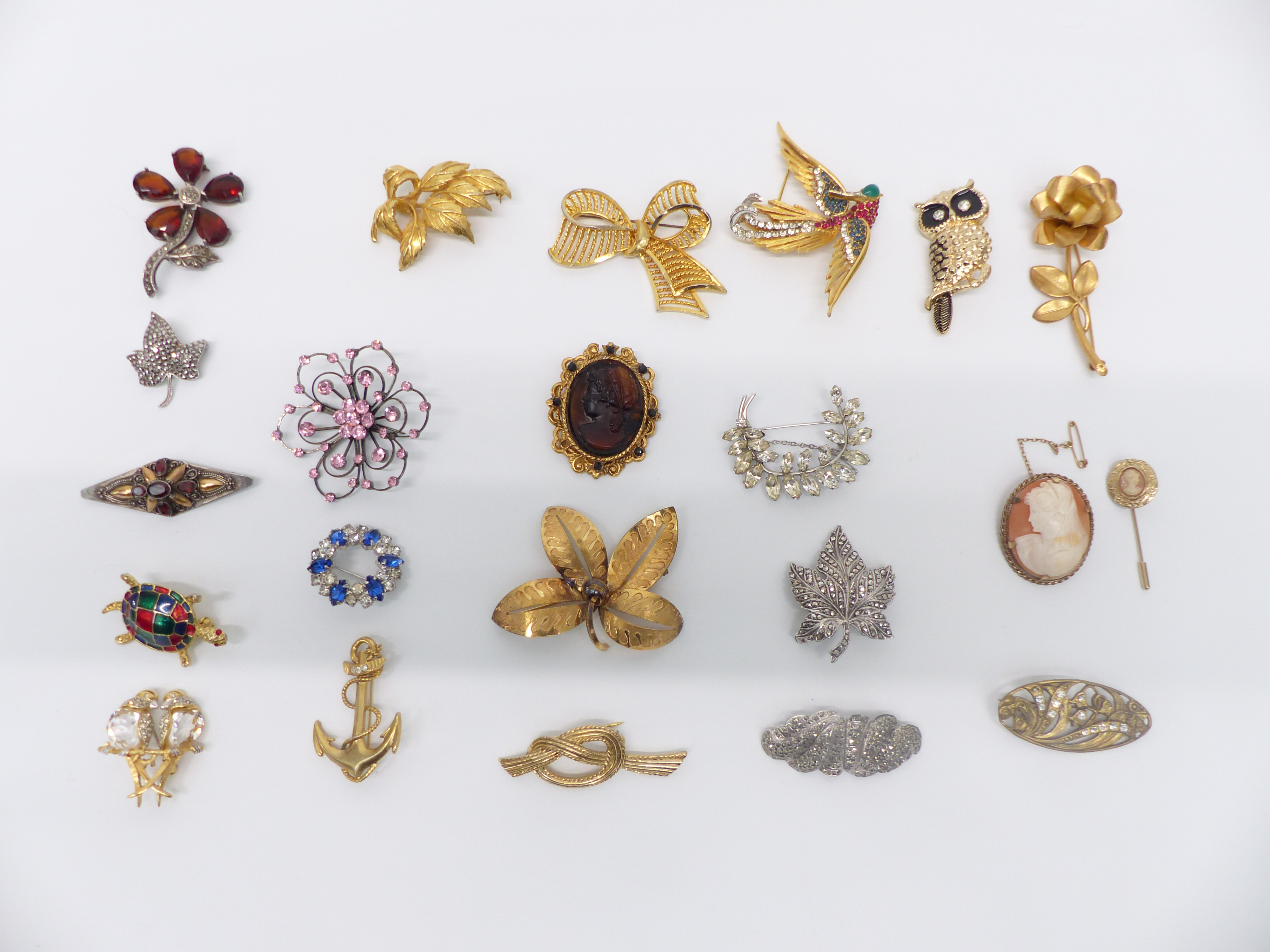 A collection of vintage brooches including three silver, Boucher, cameo, etc
