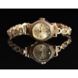 Precimax 9ct gold ladies wristwatch with gold hands and Arabic numerals, silver dial and 17 jewel