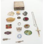 A collection of brooches including two silver, one by OMG, Victorian brooch, etc