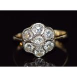 An 18ct gold ring set with diamonds in a cluster, total diamond weight approximately 1.05ct, 3.2g,
