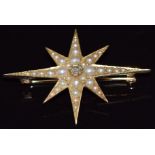 Edwardian star brooch set with a central old cut diamonds and seed pearls, 4 x 3cm, 3.2g