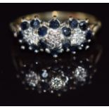 A 9ct gold ring set with diamonds and sapphires in three clusters, 2.5g, size N