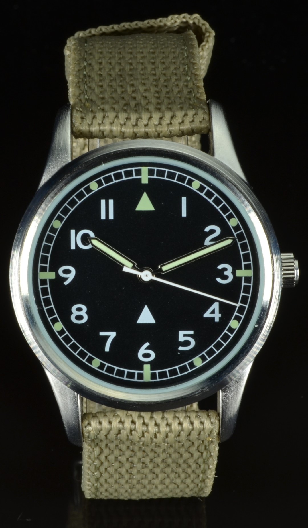 British RAF military style wristwatch with luminous hands and hour markers, white Arabic numerals,