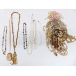 A collection of costume jewellery including necklaces, cameo brooch, etc