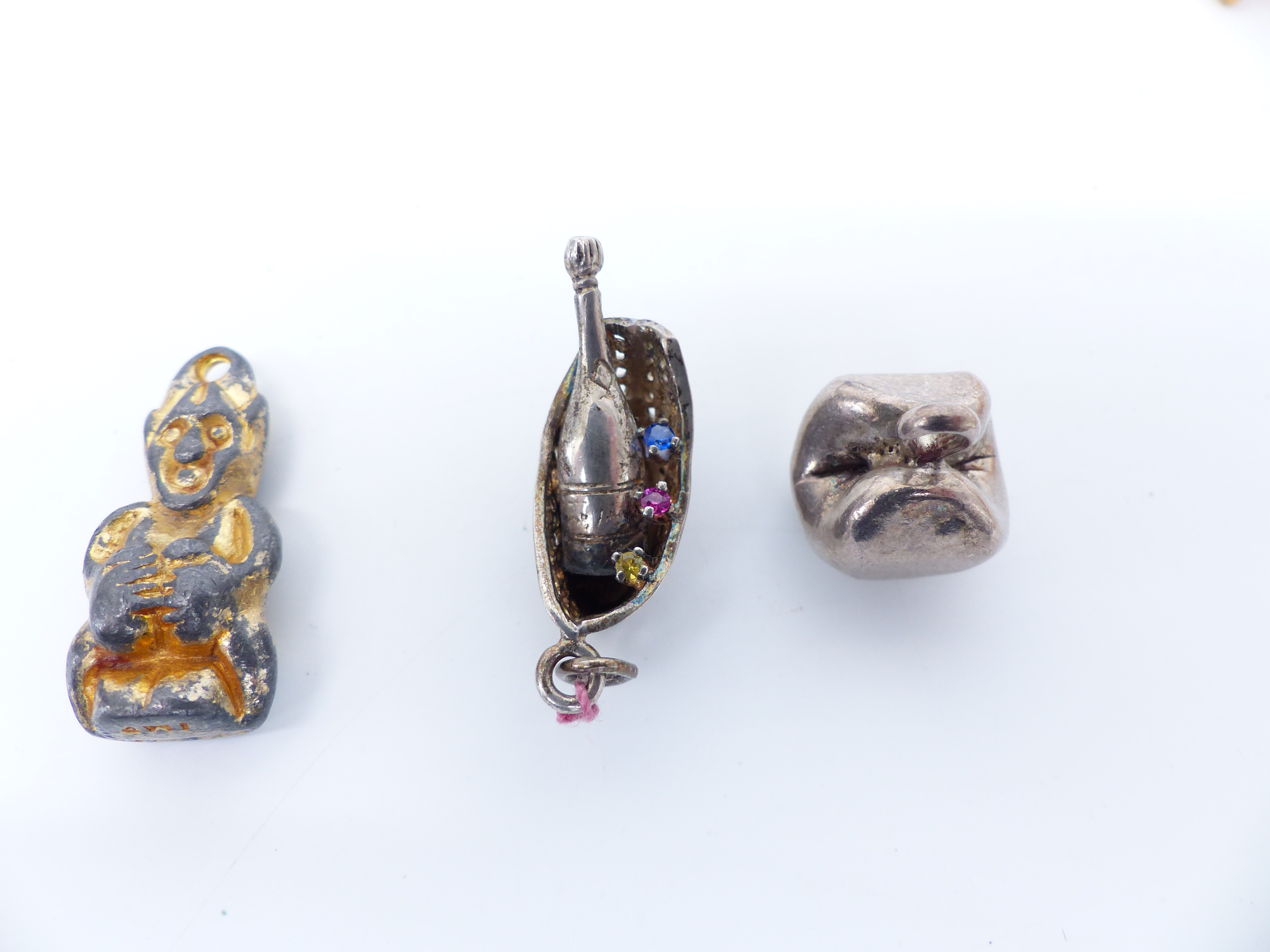 Four silver charms, a collection of floral links, four silver mounted coins, religious pendant, - Image 2 of 5