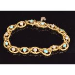 An 18ct gold c1920 French bracelet of embossed links set with turquoise and pearls, 13.6g