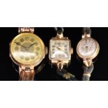 Three 9ct gold ladies wristwatches including Omega, one on 9ct gold expanding bracelet the other two