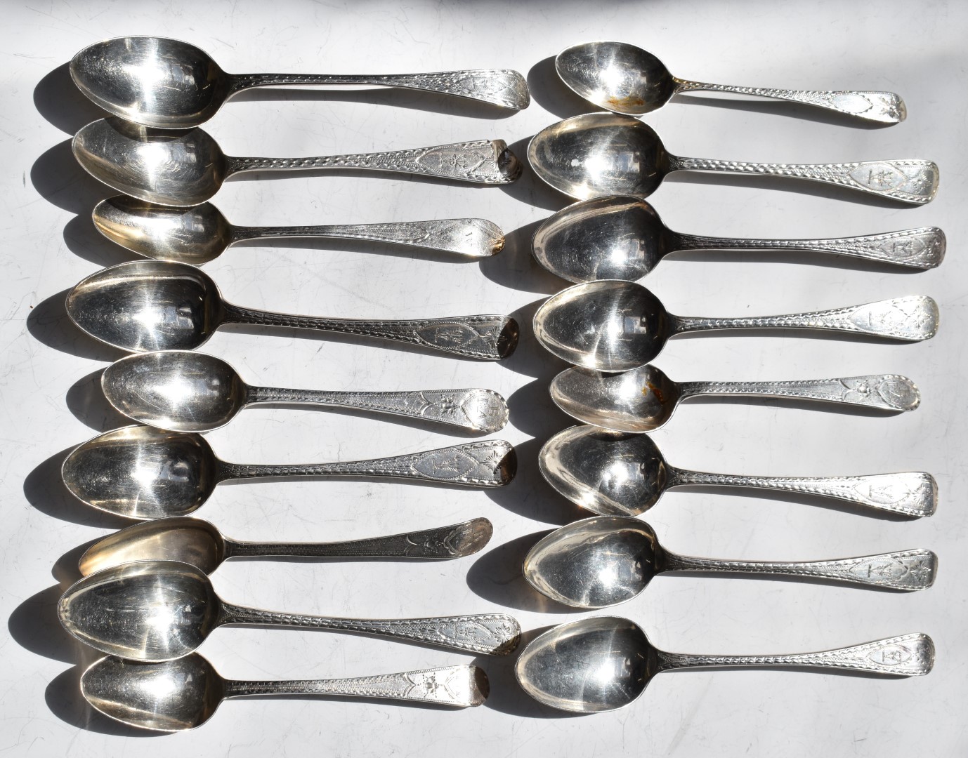 Seventeen Georgian bright cut hallmarked silver teaspoons, various dates and makers including some