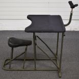 A folding metal rifle shooting bench with neoprene top and rest.