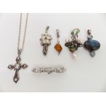 Four silver pendants, a silver Art Nouveau style brooch and another silver brooch