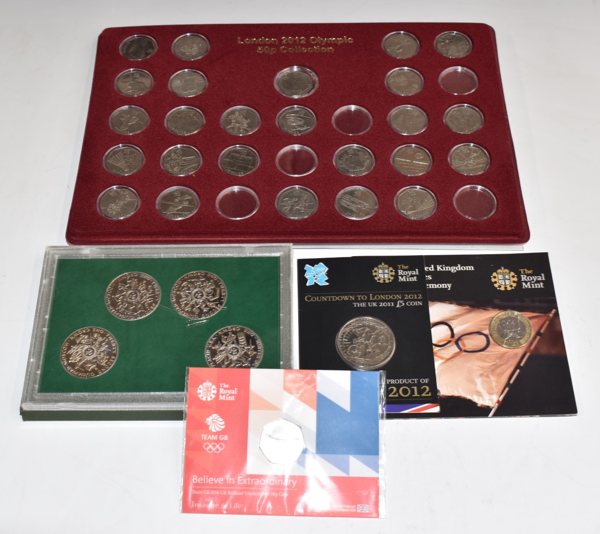 Twenty five London 2012 Olympic 50p coins (incomplete set), together with Royal Mint Olympic