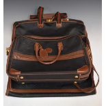 Gucci leather travel bag with three zip compartments, two with adjustable straps, 55 x 37cm, and a