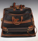 Gucci leather travel bag with three zip compartments, two with adjustable straps, 55 x 37cm, and a