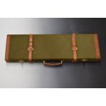 Kite canvas and leather gun case with brass locks, carry handle and padded interior, 80x24x8cm