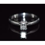 A platinum ring set with an emerald cut diamond of approximately 0.48ct, size K, 4.4g