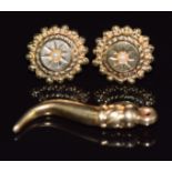 A pair of 9ct gold earrings set with a pearl to each (0.5g) and a yellow metal pendant marked 14k,