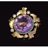 Edwardian gold pendant/ brooch set with a large round cut amethyst and seed pearls, 2.4cm, 4.5g