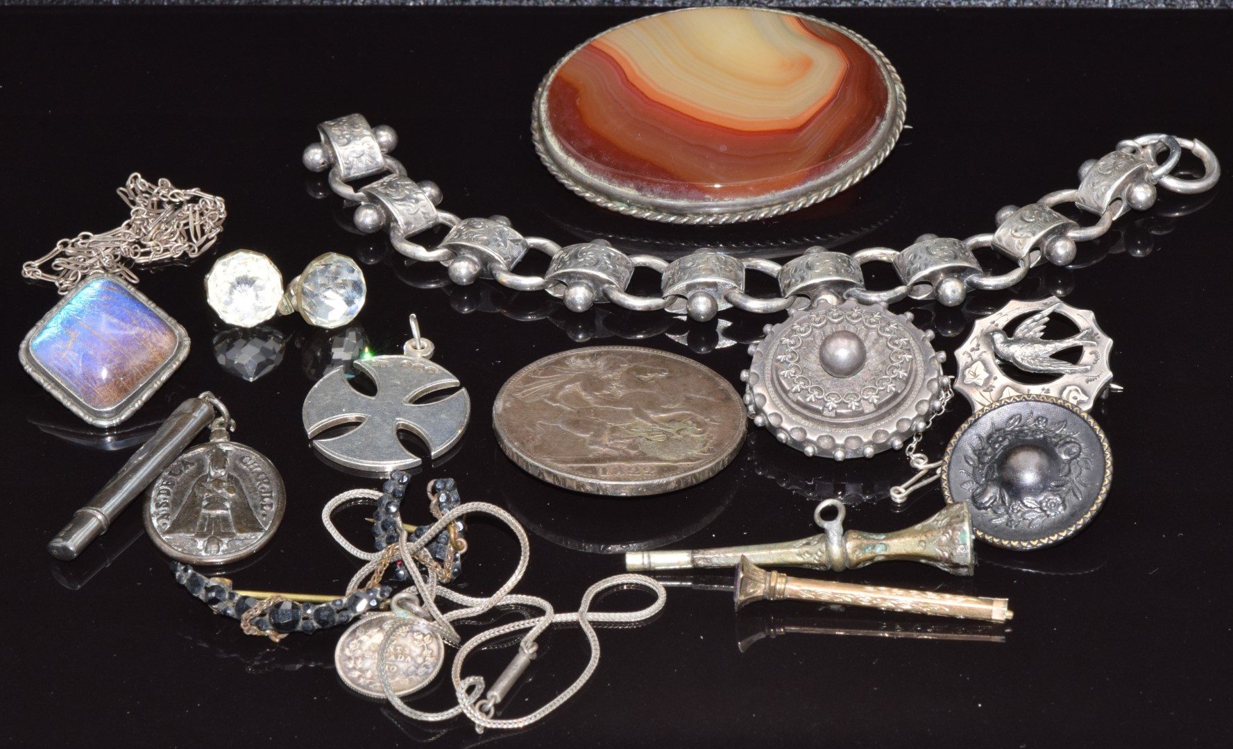 A collection of Victorian silver jewellery including bracelet, brooch depicting a swallow (