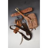 Brady canvas and leather shotgun cartridge bag together with two leather cartridge belts, three