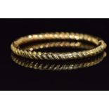 A 9ct gold bangle with ridged decoration 13.9g