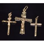 Two 9ct gold crucifix and a 9ct gold cross, 2.7g