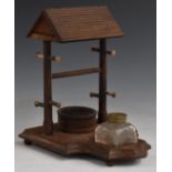 Victorian or early 20thC novelty desk stand formed as a well, with glass inkwell, stamp wetter and