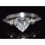 A white gold ring set with a heart cut moissanite, 3.5g, size K