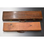 Two vintage wooden gun cases, both with fitted interiors, largest 85x21x10cm.