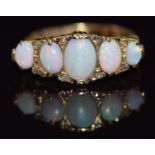 An 18ct gold ring set with five opal cabochons and rose cut diamonds, Birmingham 1903, 6.2g, size Q