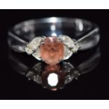 A 9ct white gold ring set with a topaz and diamonds, 2.8g, size N