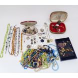 A collection of costume jewellery including Miracle brooch, scarab beetle necklace, silver brooch,